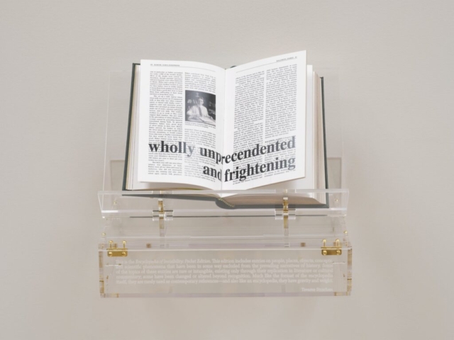 Tavares Strachan, Encyclopedia of Invisibility (Pocket Guide), 2024. Leather, gilding, archival paper, lucite box and stand. Image courtesy of the artist and Marian Goodman Gallery.